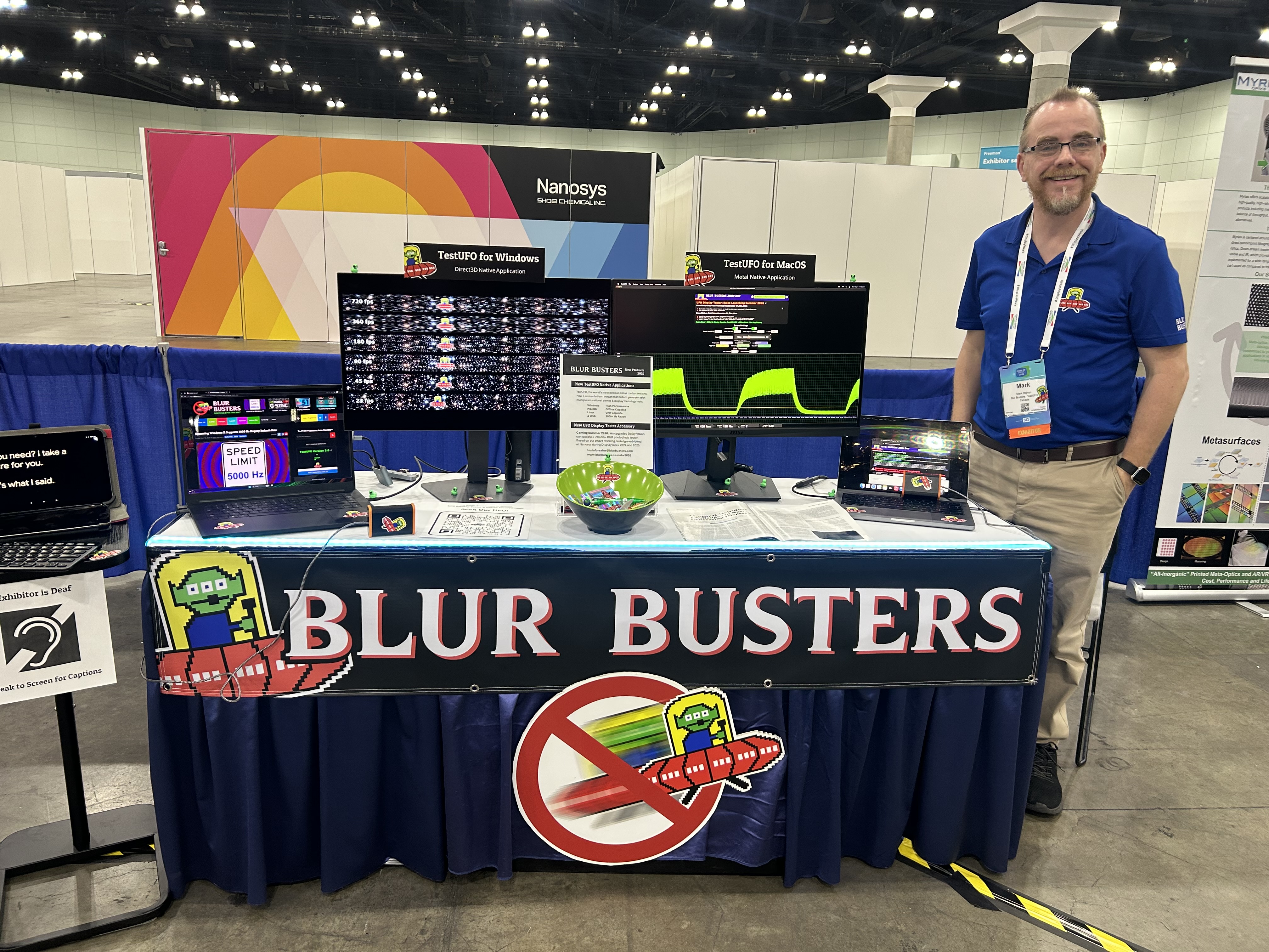 Convention exhibit showcasing Blur Busters with several monitors displaying demos.